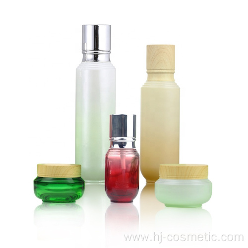 High-grade Cosmetic Gradient green glass bottles/jars with wood grain cap